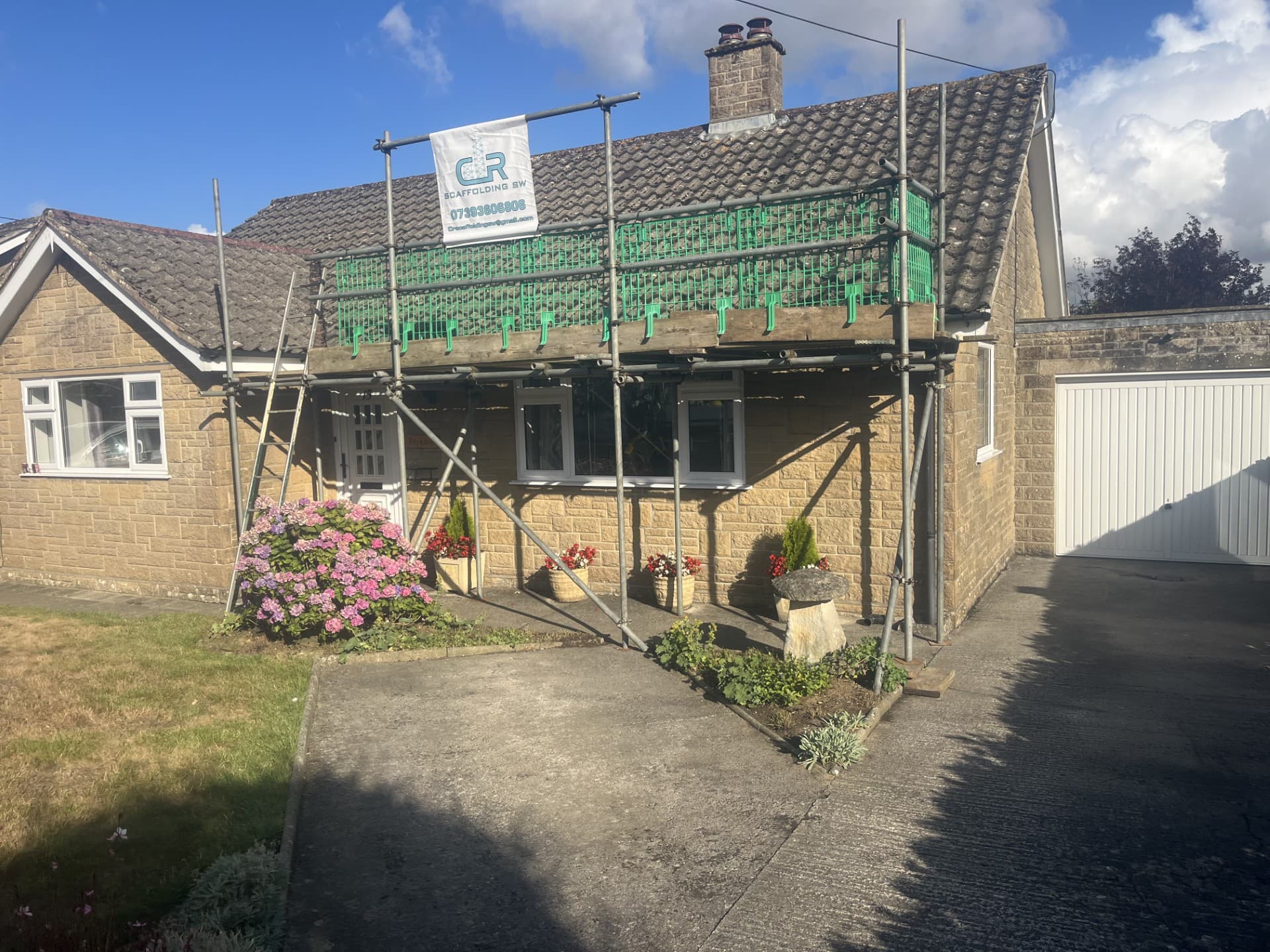 Residential scaffolding across a street-facing elevation